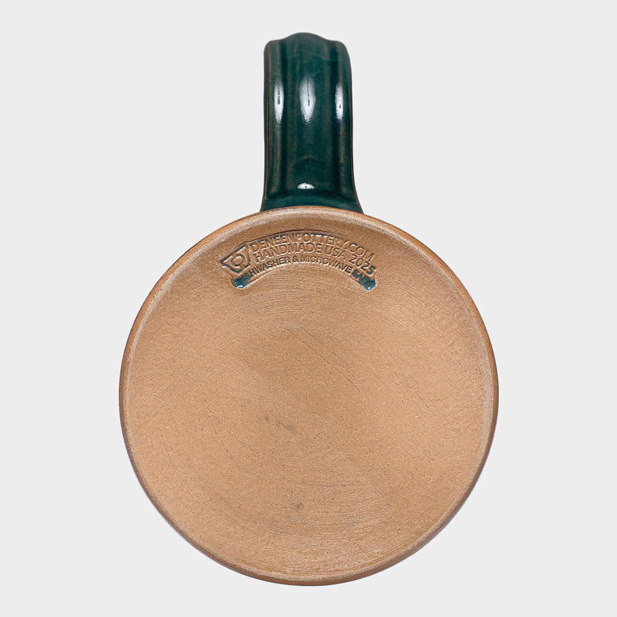 The Blue Spruce 2024 Signature Mug is handmade by Deneen Pottery.