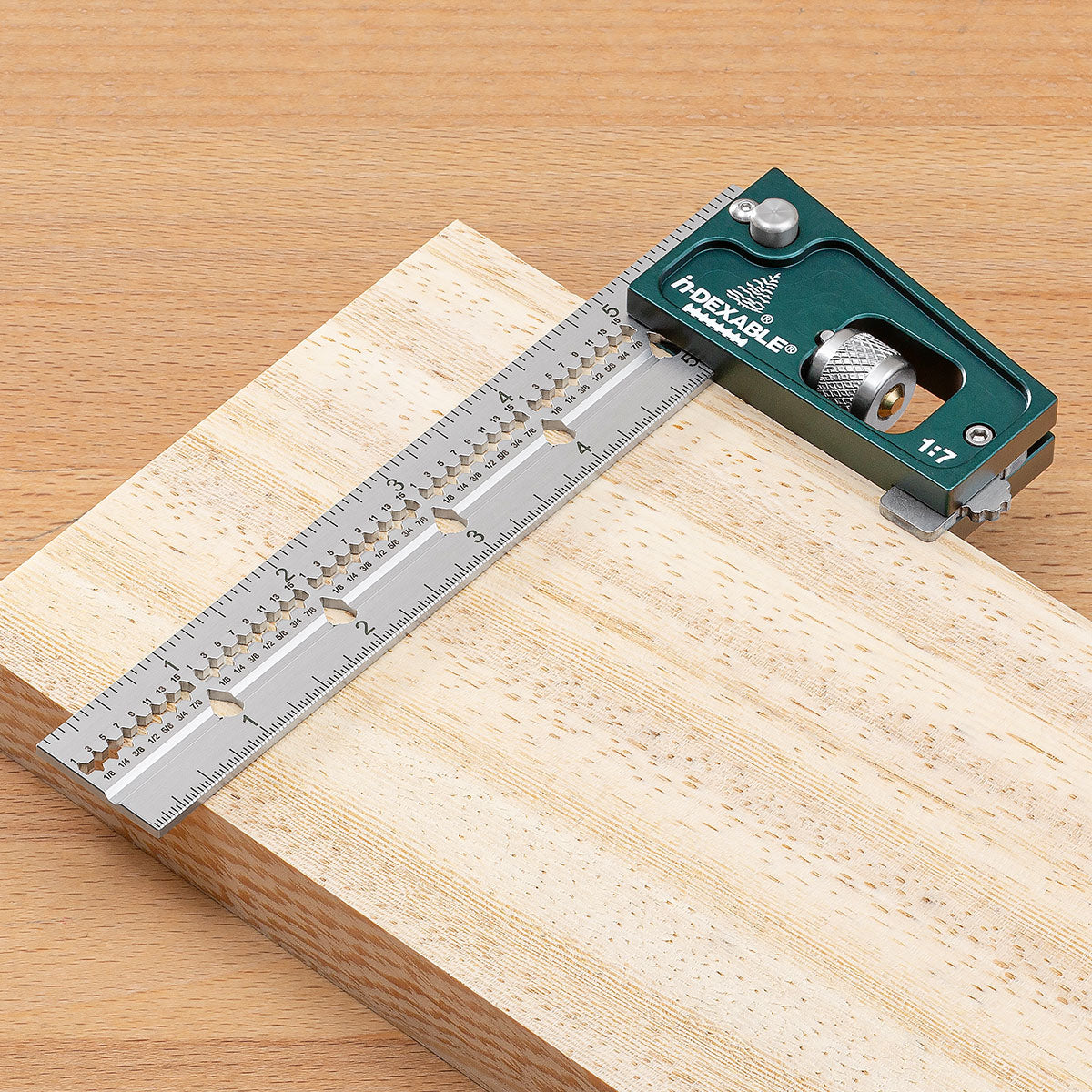 Blue Spruce Joiner's Combination Square resting flat on a board, with the tab engaged so the head does not flop off the edge.