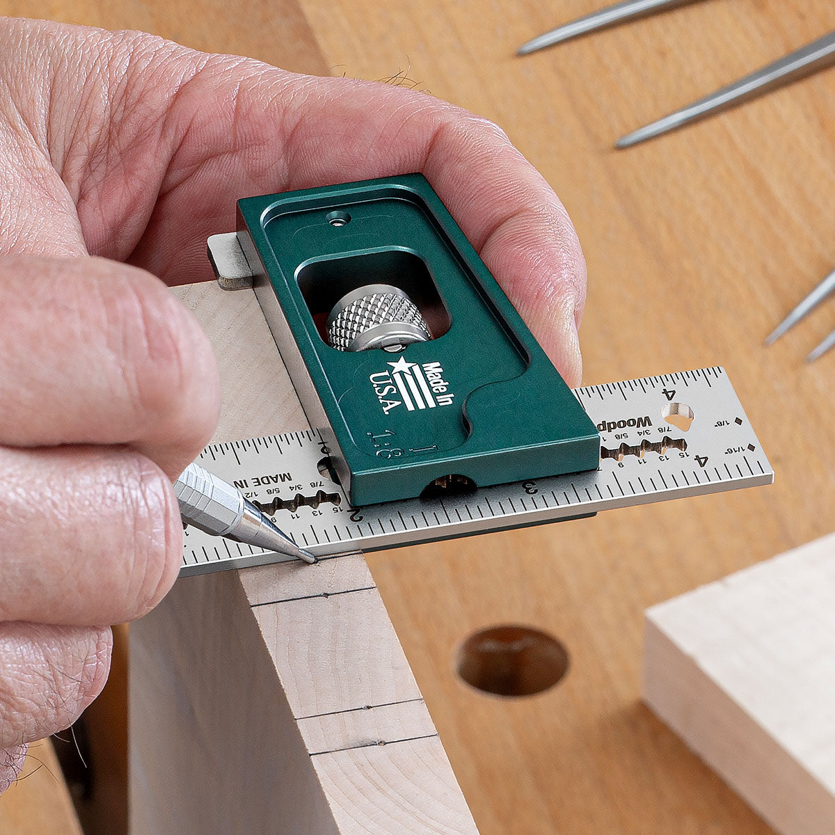 The Joiner's Combination Square standing upright on a router table to set the height of the router bit.