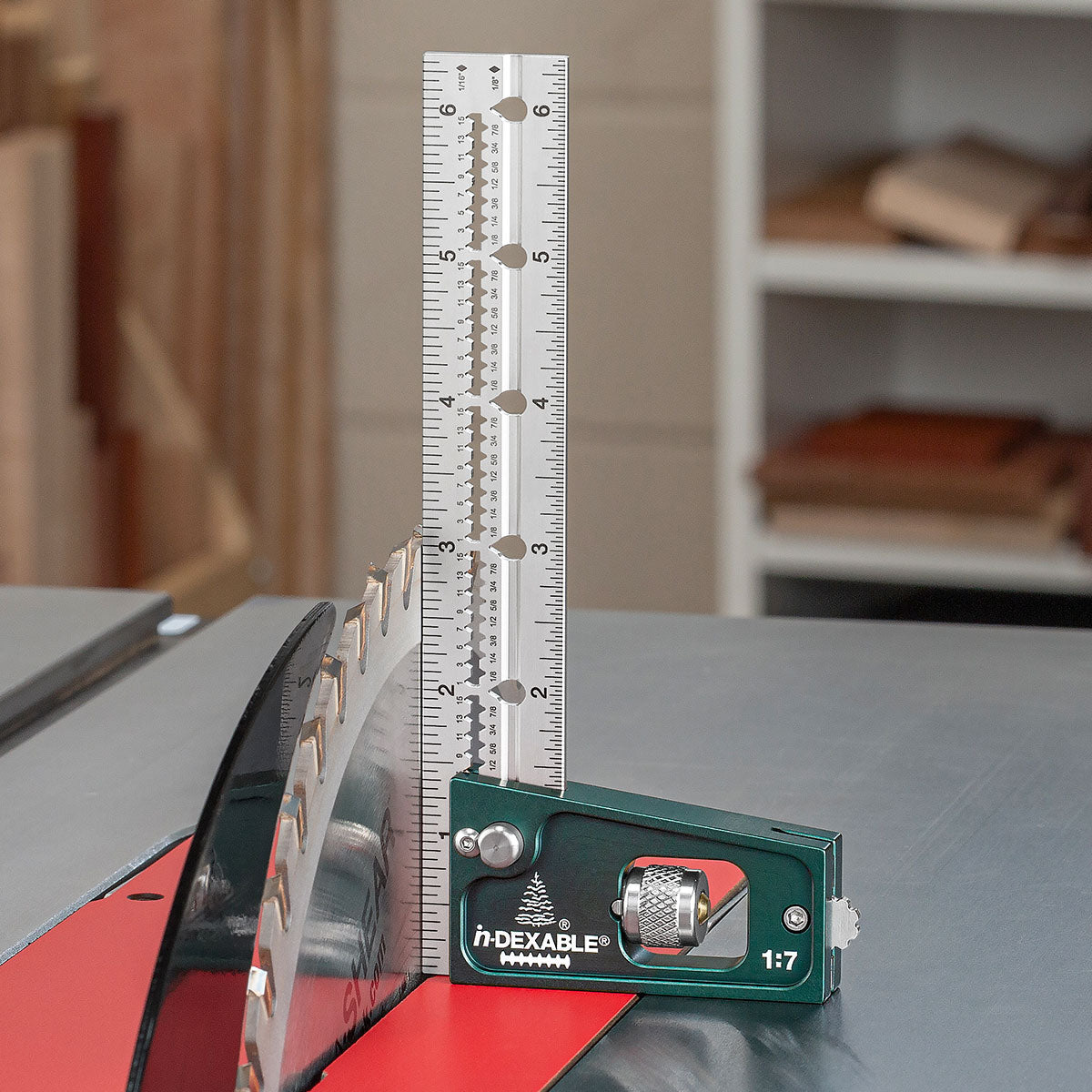 The Joiner's Combination Square standing upright on a table saw to set the height of the blade.