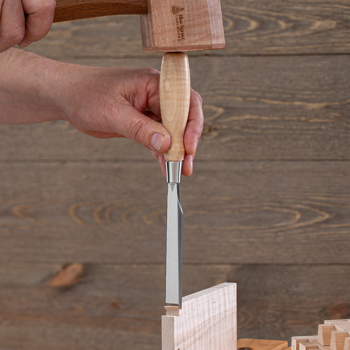 Blue Spruce Bench Chisel being driven into a cut with a mallet.
