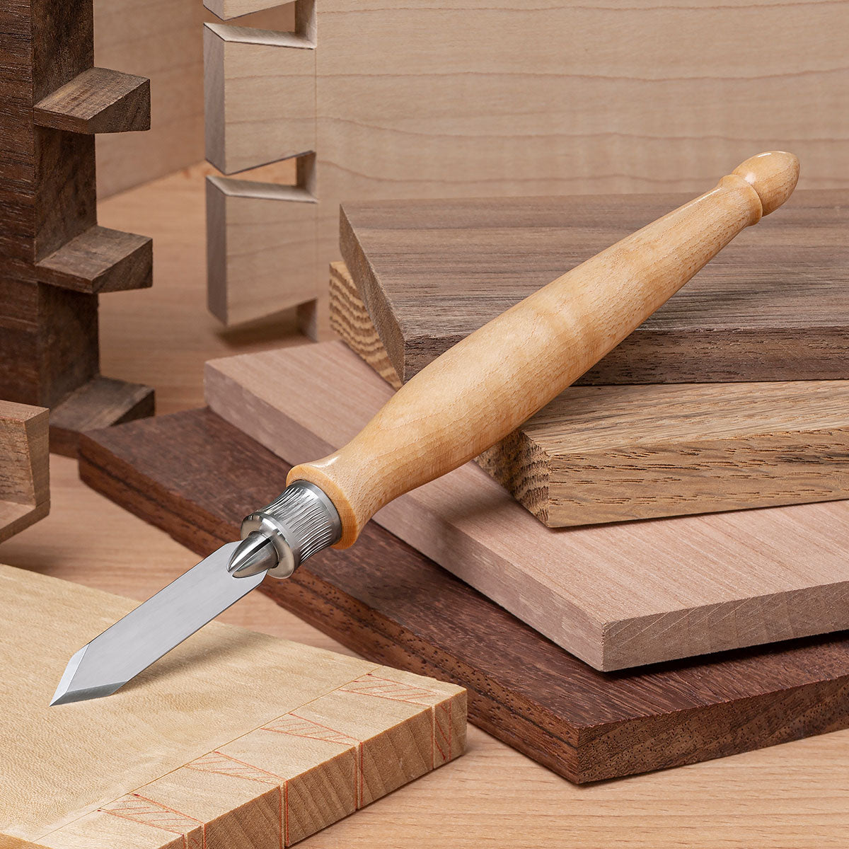 The Blue Spruce Classic Marking Knife with Resin-Infused Curly Maple handle.