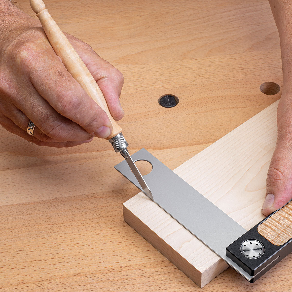 The bevel steers the blade along the reference for perfect placement of your mark.