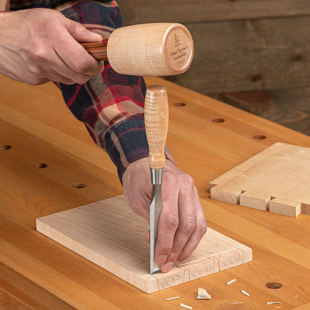 The Large Round Mallet with Bolivian Rosewood handle being used to chisel a dovetail.