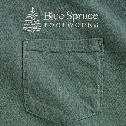 Close-up view of the front T-shirt pocket and Blue Spruce logo. 