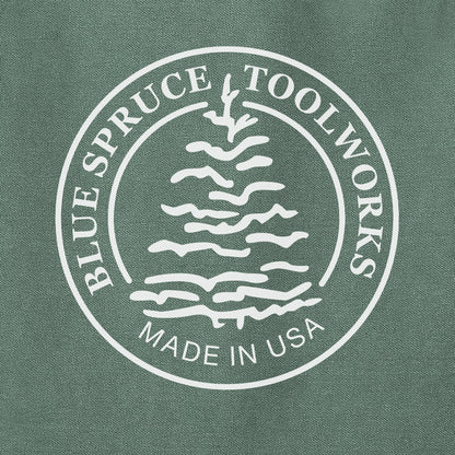 Close-up view of the Blue Spruce tree logo.