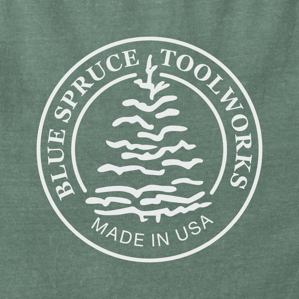 Close-up view of the back Blue Spruce Logo.