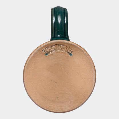 The Blue Spruce 2024 Signature Mug is handmade by Deneen Pottery.