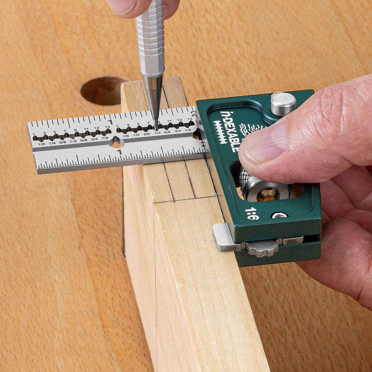 Using the 90-degree side of the head to mark parallel lines for a tenon using the scribing notches.
