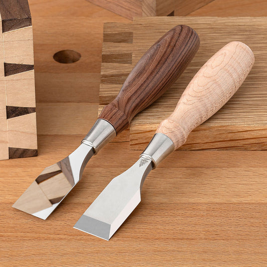 Two Blue Spruce Butt Chisels with 1” blades. Bolivian Rosewood handle on the left and a resin-infused Curly Maple handle on the right.