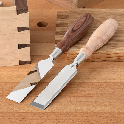 Two Blue Spruce Dovetail Chisels with 1” blades. Bolivian Rosewood handle on the left and a resin-infused Curly Maple handle on the right.