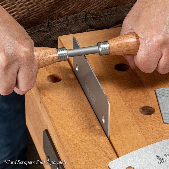 Beech Dual-Handle Burnisher being pulled across the bottom cutting edge of a Blue Spruce Card Scraper.