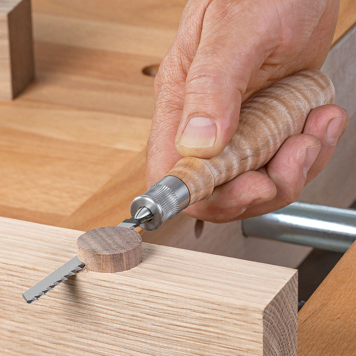 The Blue Spruce Jigsaw Blade Handle flush cutting a dowel.