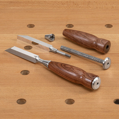 An “exploded” view of a Blue Spruce Mortise Chisel, showing an assembled chisel next to the blade, ferrule, central rod, and Bolivian Rosewood handle.