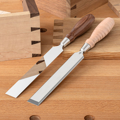 Two Blue Spruce Paring Chisels with 1” blades. Bolivian Rosewood handle on the left and a resin-infused Curly Maple handle on the right.