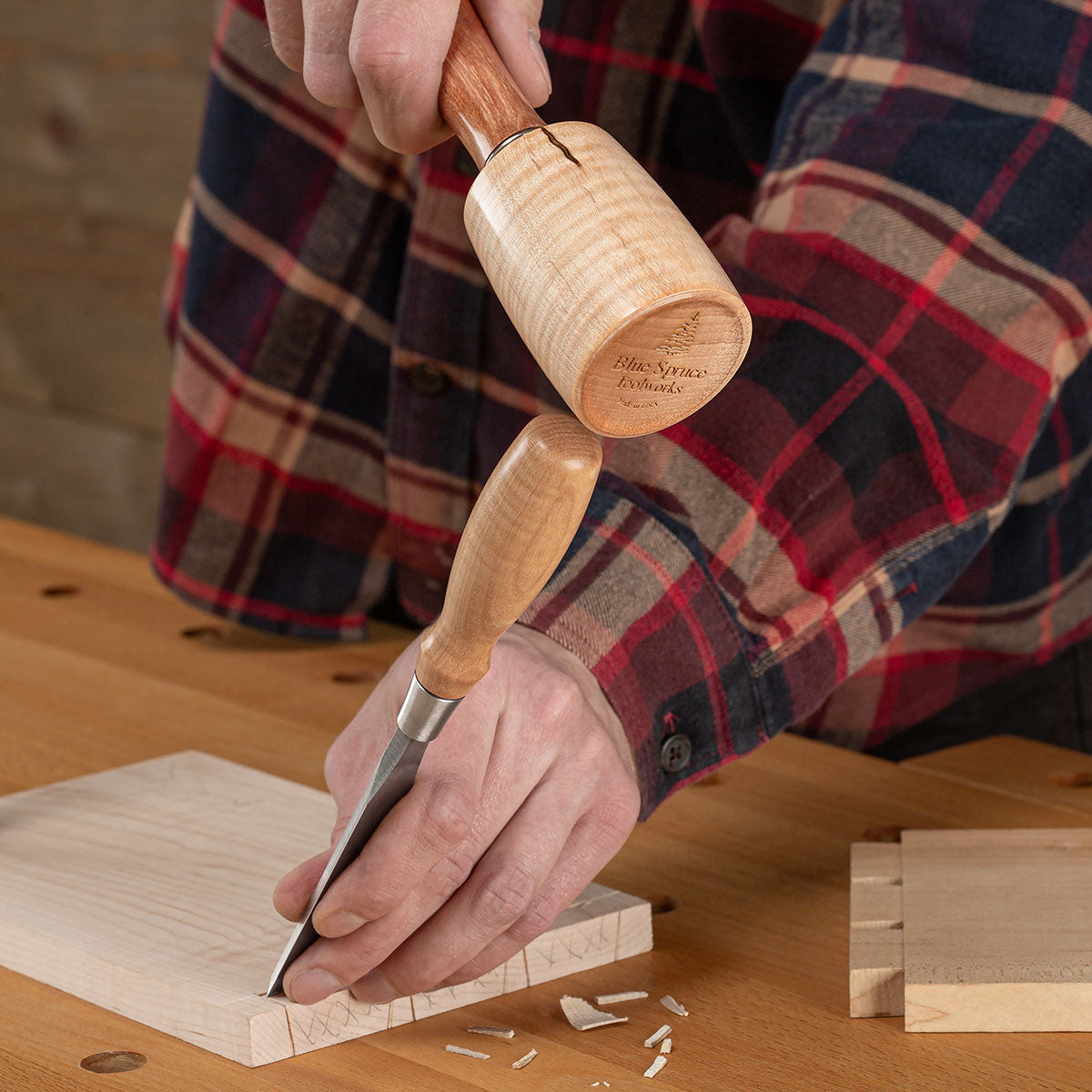 The Small Round Mallet with Cherry handle being used with an Optima Chisel to clear waste from a marked dovetail. 