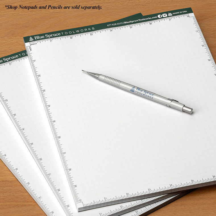3 Blue Spruce Shop Notepads and the Blue Spruce Mechanical Pencil together on a workbench.