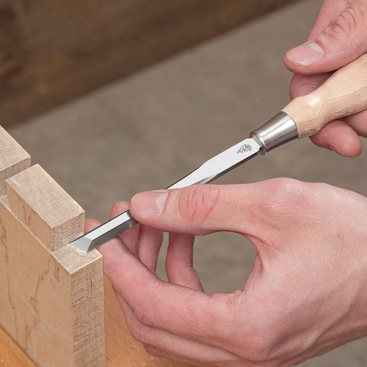 Blue Spruce Skew Chisel cleaning a cut dovetail.