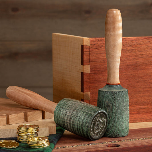  Two Blue Spruce Limited-Edition Lucky Round Mallets on a workbench.